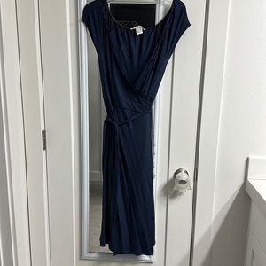10/12 Navy blue wrap dress with cute fringe detail. Knee length, soft material.